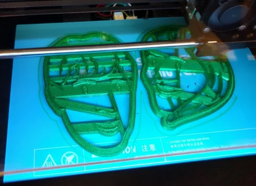 The paths imported from Illustrator were thickened and extruded to various heights to create the cookie cutter shapes. Printing Printing