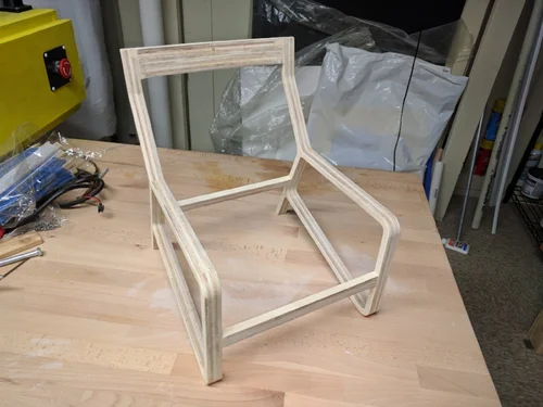 A roll of leather that I have been hoarding for a while knowing it would come in handy one day.  It was rescued off a couch that was going in the dumpster. Finished and sanded chair frame.