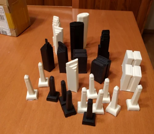 Here is an in progress photo of casting some pawns as well as experimenting with resin dye to find the right shade of black. Casting Casting